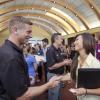Two people networking at an event on campus