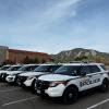 CU Boulder police cars with Flatirons in the background