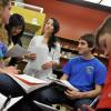 Cassandra Ly is shown in 2009 working with students