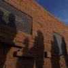 The shadows of visitors seen on the wall of the Columbine Memorial