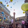 Students release biodegradable balloons as part of a class