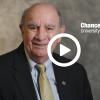 Chancellor Phil DiStefano with a video play button overlay