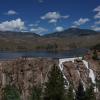 Cheesman Dam spills water down its spillway, a 220-foot high wall of boulders, in June 2019. Photo: Denver Water.