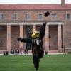 Chip tossing a graduation cap