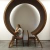 Woman sits unique circle table