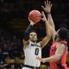 Cliff Dayton points the basketball to shoot