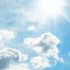 A stock image the sky with clouds and the sun