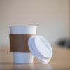 Disposable coffee cup in a board room