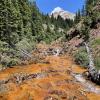 Iron oxides stain the bed of Upper East Mancos River in southwestern Colorado
