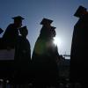 Silhouettes of graduates processing