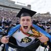 Graduate pulls a Superman, exposing a CU Buffs shirt under his robe