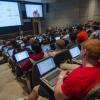 Students with laptops open in classroom