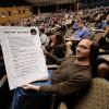 Student in Pathway to Space class holds up signed course contract