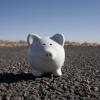 White piggy bank in a desert