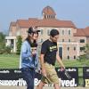 Students walk on campus near Leeds School of Business