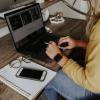 A person working on a laptop from home