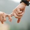 A couple holding hands with matching tattoos