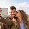 Couple taking a selfie with a smartphone