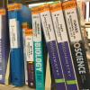 Textbooks on shelf in library
