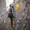 student rock climbing at The Rec
