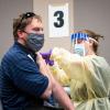 A person receiving a COVID-19 vaccination at SEEC