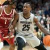 McKinley Wright IV driving to the basket against Stanford
