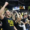 Fans cheer on the CU men's basketball team