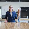 Madalyn Kern stands in the Idea Forge with a prosthetic leg 