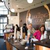 Students working in Laughing Goat coffee shop inside Norlin Library
