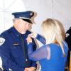 Commander Michael Lowry is pinned by his wife Elizabeth
