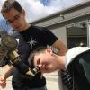 CU-STARs student volunteer helps child look through telescope