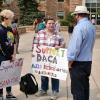 People hold DACA support signs at CU Boulder