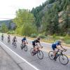 Cyclists riding on a road in the mountains