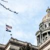 Denver capitol building with state and national flag flying