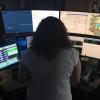 dispatcher looks at several computer monitors