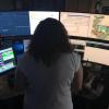 dispatcher looks at several computer monitors