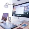 Laptop, desktop computer and phone on a desk