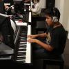 Elementary student practices during Piano for Dreamers class