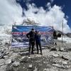 Researchers with CU Boulder and CSU signs at the Everest base camp