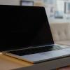 Laptop in front of a couch.