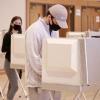 students casting ballots in the UMC Vote Center