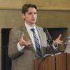 Elias Sacks speaks at a conference