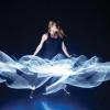 A performer dancing with lights