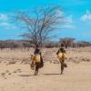 Two people collect water in Turkana, Kenya