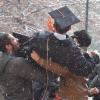Family celebrates a College of Engineering and Applied Science winter graduate in the snow