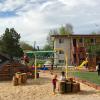 children play at new Kendall Apartments playground