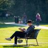 person sitting on bench outside