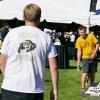 Students play corn hole on the lawn during a tailgate