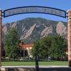 Farrand Field entrance with green field and Flatirons beyond
