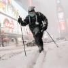 Person uses skis to traverse snowy New York City